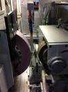 Blick in den Bearbeitungsbereich einer Ghiringhelli Centerless spitzenlosen Rundschleifmaschine
